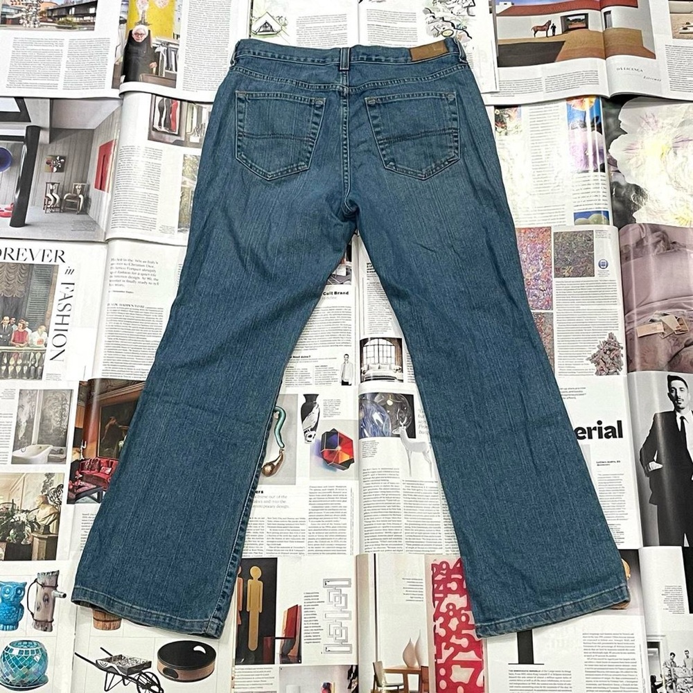 Tommy Hilfiger medium wash mid rise wide leg bootcut jeans